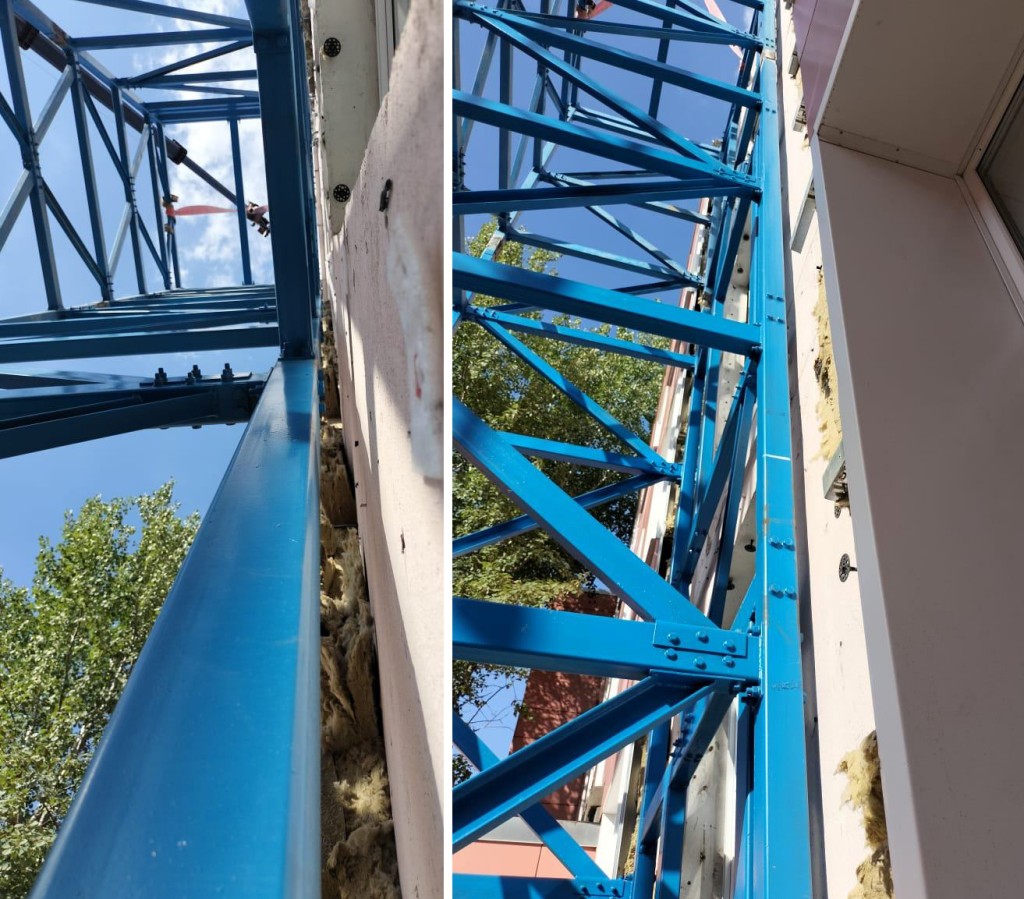 Каркас шахты проходит в паре сантиметров от стены здания