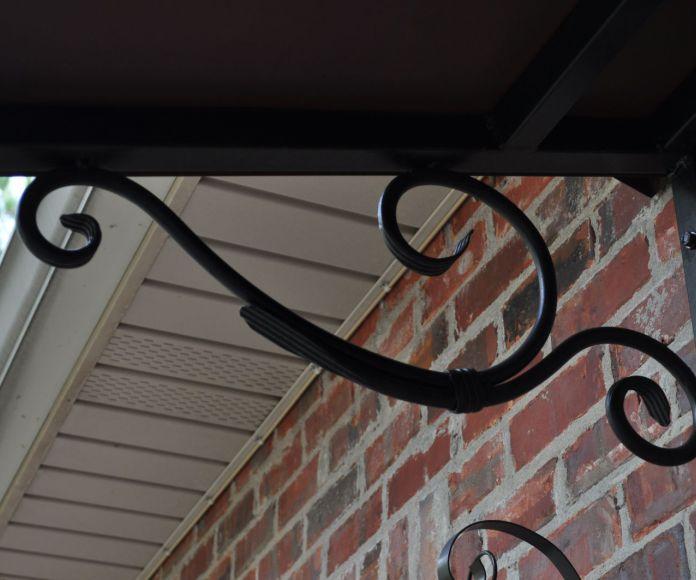 Фото Козырек кованый